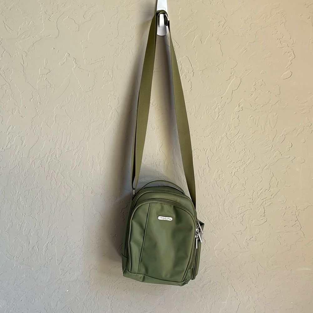 Travelon green crossbody bag multiple zippers adjustable strap canvas